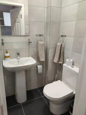 a bathroom with a white toilet and a sink at Studio in the centre of Nicosia 2 in Nicosia