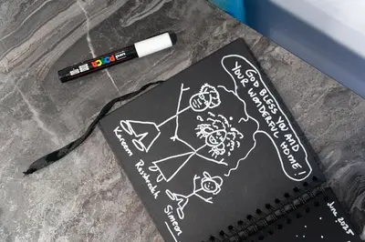 a notebook with a drawing on it next to a pen at Heart Of Nicosia - The Gem in Nicosia