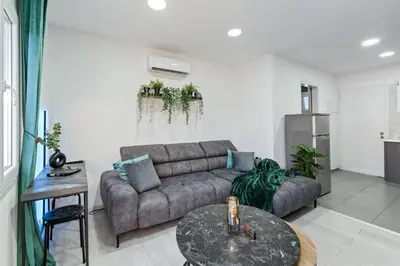 a living room with a couch and a table at Heart Of Nicosia - The Gem in Nicosia