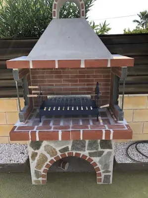 a brick oven with a bench in front of it at Palm Villa 3 bedrooms - Sleeps 6 in Ayia Napa