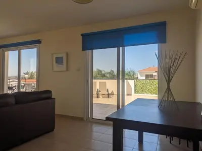 a living room with a couch and a table at Kiti 2 bedroom Penthouse in Kiti