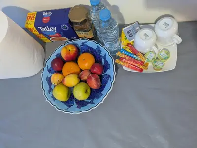 a bowl of fruit on a table with some milk at Kiti 2 bedroom Penthouse in Kiti