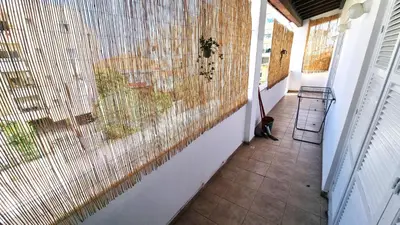 a hallway with a large window in a house at Lovely 1BR in Old Town - City Center & 4min to Beach in Scala