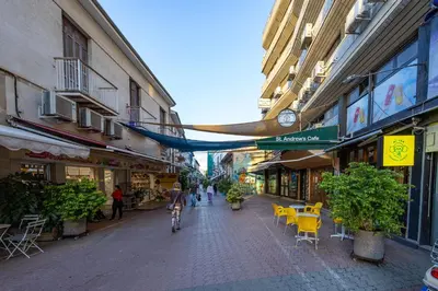 a city street with tables and chairs and buildings at 75 Prokymea- Steps from the Sea, Downtown, Balcony in Limassol