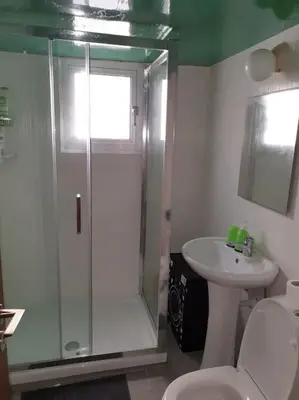 a bathroom with a shower and a toilet and a sink at Cozy comfortable 2-bedroom apartment in Limassol