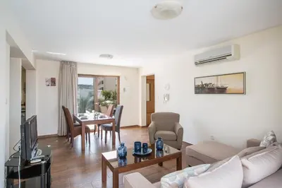 a living room with a couch and a table at Napiana Apartments in Ayia Napa