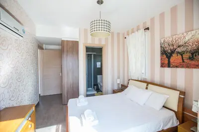 a bedroom with a white bed in a room at Katerina Luxury Villas in Protaras