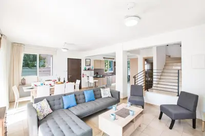 a living room with a couch and a table at Katerina Luxury Villas in Protaras
