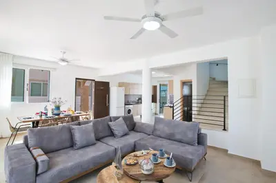 a living room with a couch and a table at Katerina Luxury Villas in Protaras