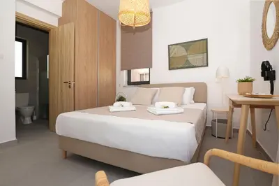 a bedroom with a bed with two towels on it at Villa Flora - 3Bed all En-suite with Private Pool in Paralimni
