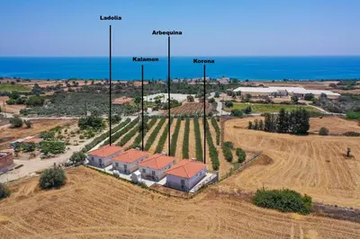 an aerial view of a house in a field at Eleonas Seaview Cottages in Alaminos