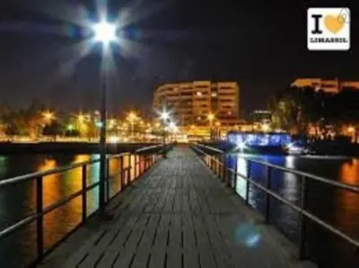 a street light on a pier at night at Cristiana Sea Breeze, Sleeps 3, Free Wifi in Limassol