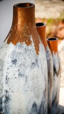 a group of three vases sitting next to each other at Sirena Bay Beach House and Luxury Suites in Protaras