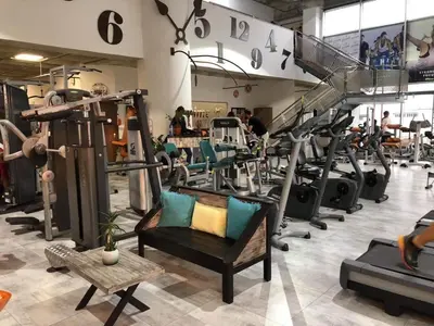 a gym with a bunch of tread machines at Ithaki Phinikoudes Apartment No. 105 in Larnaka