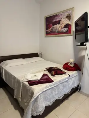 a bedroom with a bed with a teddy bear sitting on it at Διαμέρισμα ισόγειο για ενοικίαση in Limassol
