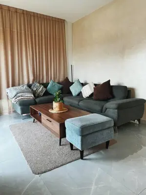 a living room with a couch and a coffee table at 3 Br Penthouse Jacuzzi Seaview in Limassol