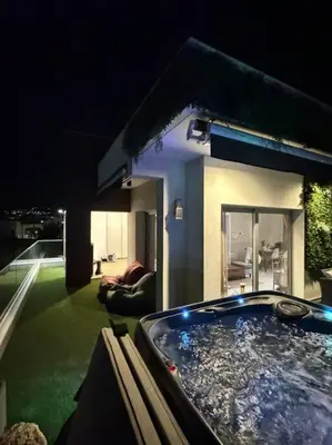 a jacuzzi tub in the backyard of a house at 3 Br Penthouse Jacuzzi Seaview in Limassol