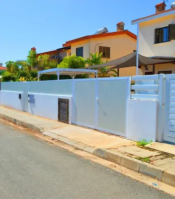 a blue fence on the side of a street at Ayia Napa Marina Luxury Villas - Pearl in Ayia Napa