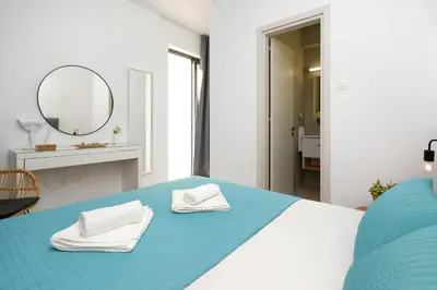 a bedroom with a bed with two towels on it at Villa Merope - 3Bed All En-suite in Paralimni