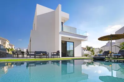 a swimming pool in front of a villa at Villa Merope - 3Bed All En-suite in Paralimni