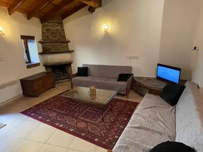 a living room with a couch and a coffee table at House No9 - Studio in Kakopetria