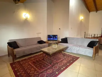 a living room with a couch and a coffee table at House No9 - Studio in Kakopetria