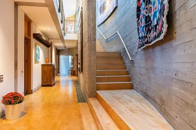 a staircase in a building with a brick wall at Paradise Peek, Platres in Platres