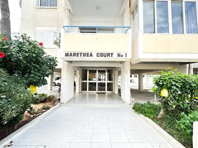 a building with a sign that reads mataria court at Sea and Lake Breeze 1BR Apt in Larnaka