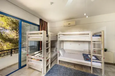 two bunk beds in a room with a window at Ayia Napa Sycamore SeaView in Ayia Napa