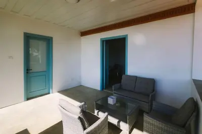 a living room with a couch and a table at Dipaton House in Vasa 2 in Vasa Kilaniou
