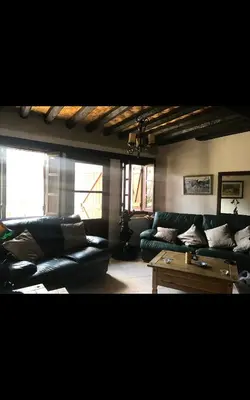 a living room with a couch and a coffee table at Clover Cottage in Limassol
