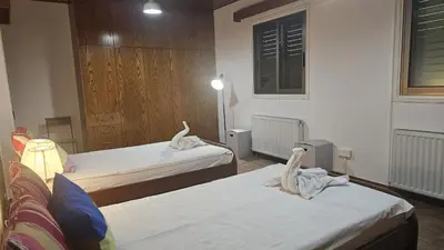 a room with two beds with towels on them at STAY Uptown Apartment in Engomi