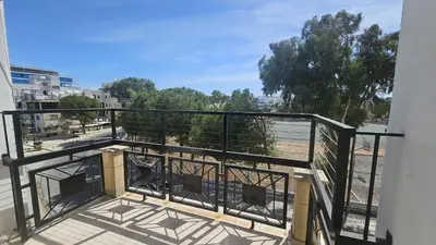 a balcony with a view of a beach at STAY Uptown Apartment in Engomi
