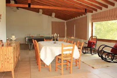 a dining room with a table and chairs at Villa in Moniatis in Moniatis