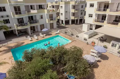 an aerial view of an apartment complex with a swimming pool at Obv 5201 in Pyla