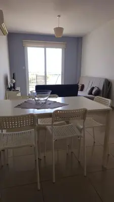 a white table and chairs in a living room at Obv 5201 in Pyla
