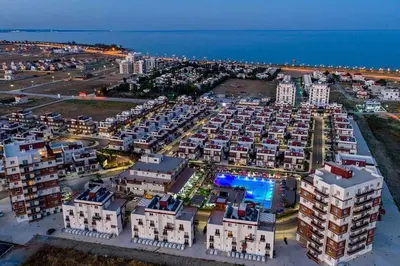 an aerial view of an apartment complex at night at The Aqua Marine Flat in Iskele