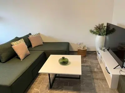 a living room with a couch and a coffee table at The Aqua Marine Flat in Iskele