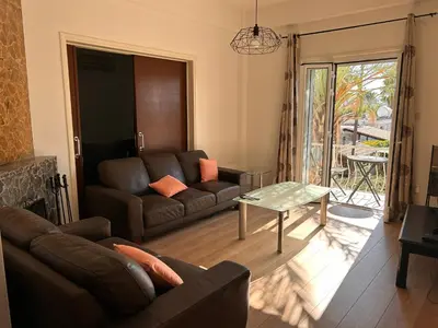 a living room with a couch and a table at Bougainvillea in Nicosia