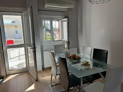 a dining room with a table and chairs at Bougainvillea in Nicosia