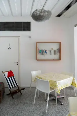 a room with a table and chairs and a painting on the wall at ResArt Traditional House in Nicosia