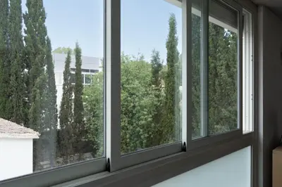 a group of windows in a room with trees at ResArt Traditional House in Nicosia