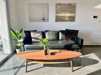 a living room with a couch and a coffee table at V-Premium Brand New Central flat in Limassol