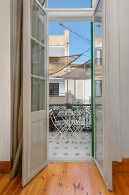 an open door to a patio with a table at Klokkari Stays - Cozy Stay City Center By Platform 357 in Nicosia