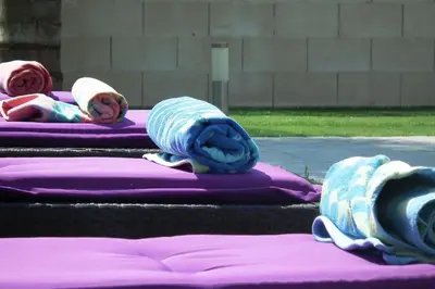 a group of three babies laying on purple blankets at Villa Anthea-beach-private pool in Meneou