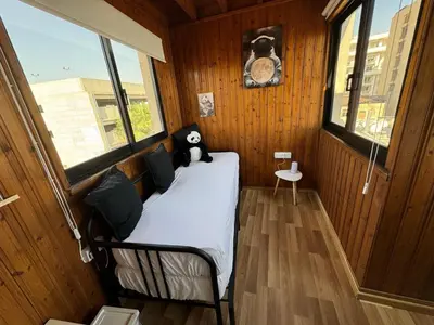a bedroom with a bed with a stuffed animal on it at It can't be more central Larnaca in Larnaka