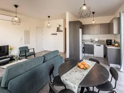 a living room with a couch and a table at Mythical Blue Apartment 004 in Protaras