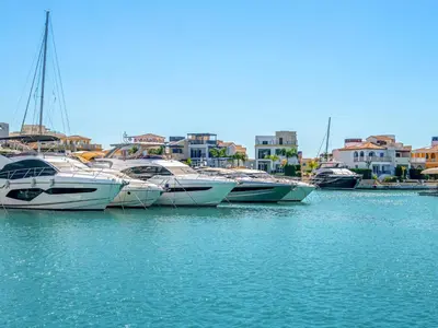 a group of boats are docked in a harbor at Sanders Breeze Limassol in Limassol