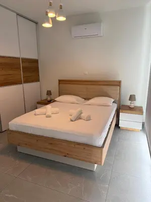 a bedroom with a bed with two towels on it at Theo luxury Napa villa in Ayia Napa