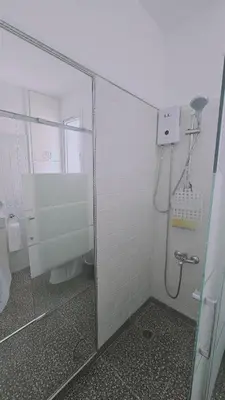 a bathroom with a shower with a glass door at STAY Limdream Apartment in Limassol